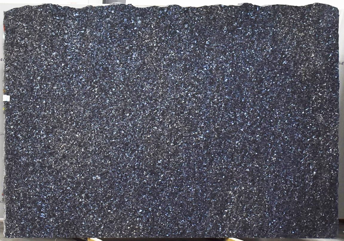 Dark granite slab with shimmering, speckled surface.