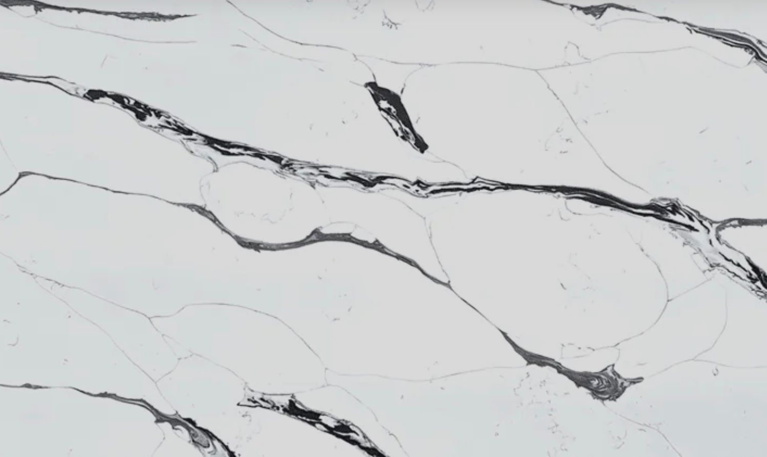 White countertop with dark gray veining.