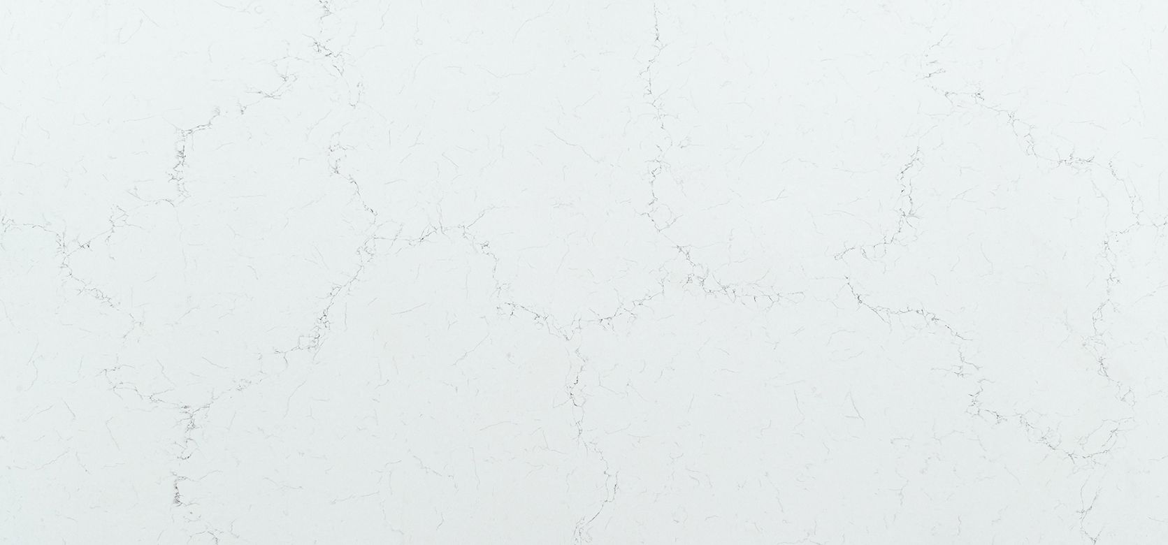 White marble countertop with subtle gray veining.