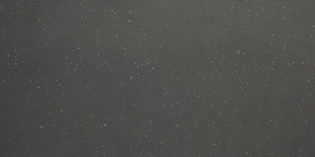 Dark gray speckled surface.