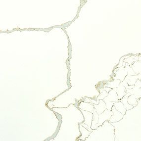 White surface with gold veining, resembling marble or quartz.