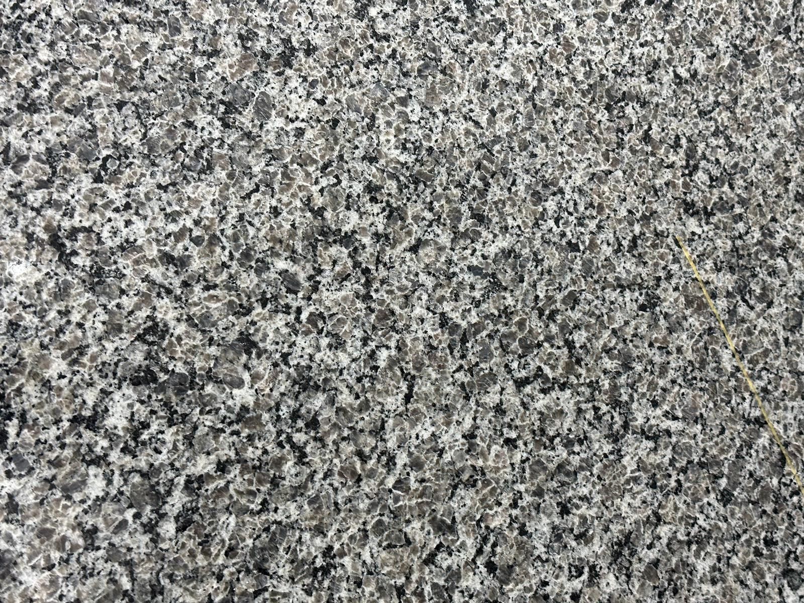 Close-up of a granite countertop, speckled with shades of gray, white, and black.