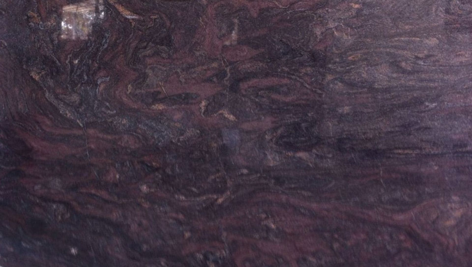 Swirling dark maroon and black abstract texture.