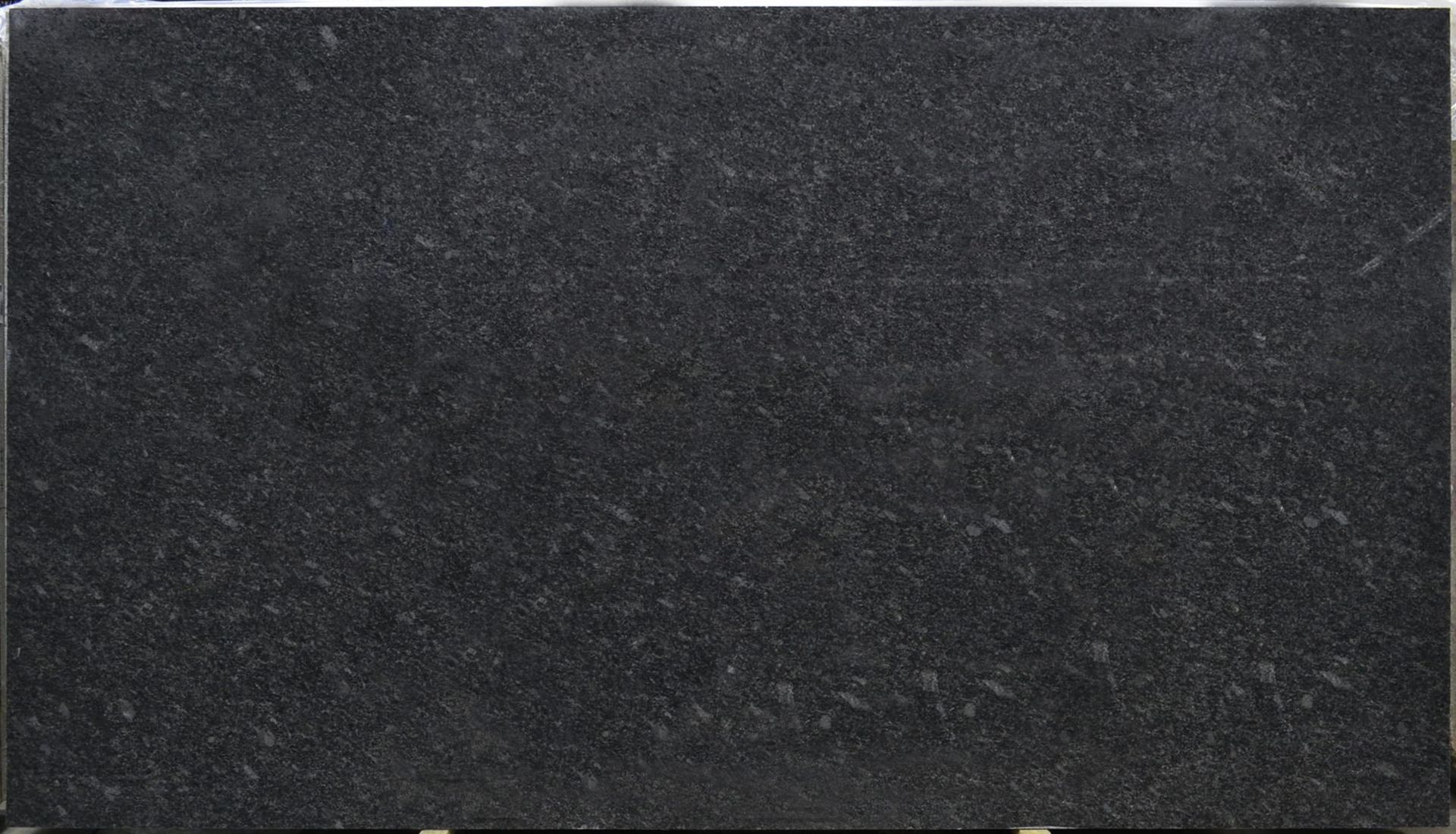 Dark gray granite slab with speckled texture.