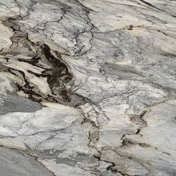 Close-up of marble slab with grey, white, and black veining.