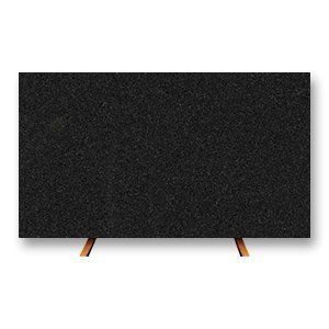 Black granite slab on two wooden stands.