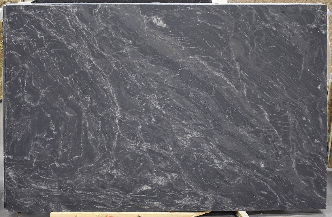 Dark gray stone slab with white veining.