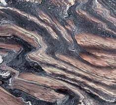 Swirling marble pattern with shades of black, brown, and beige.