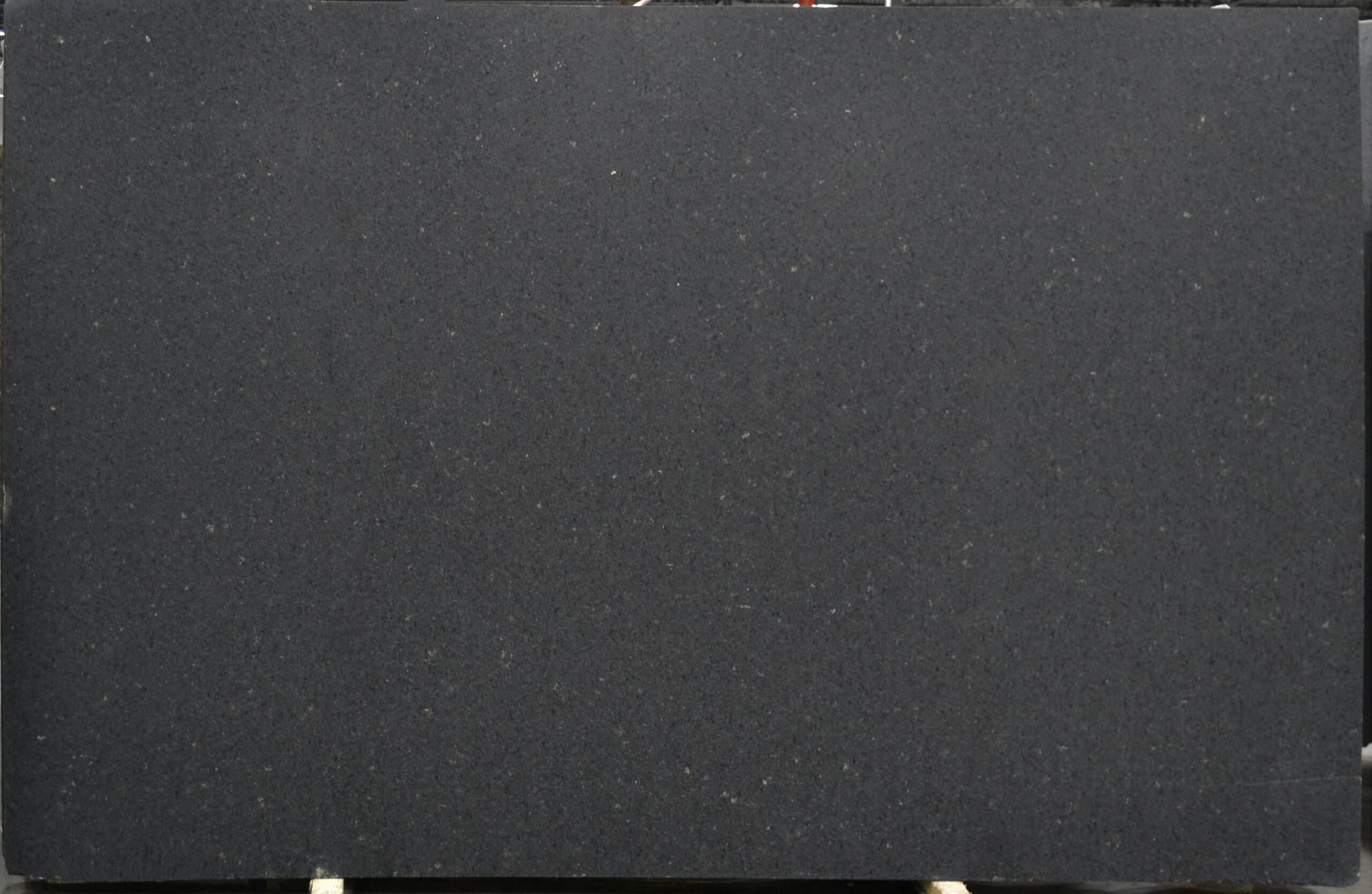 Black granite slab with a speckled texture.