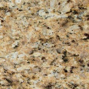 Close-up view of granite with gold, brown, and black speckles.