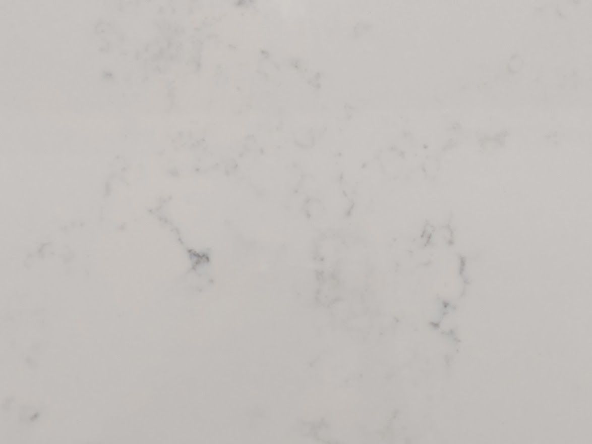 White quartz countertop with subtle gray veining.