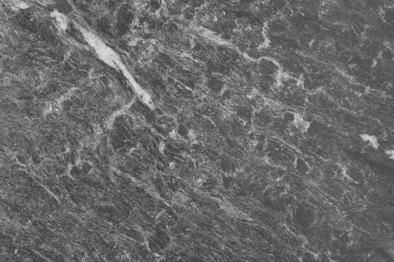 Gray marbled stone surface with white veining.