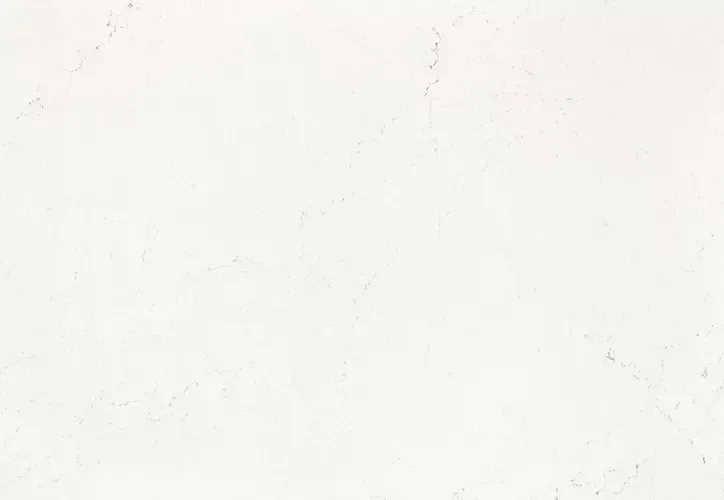 White textured wall with subtle imperfections.