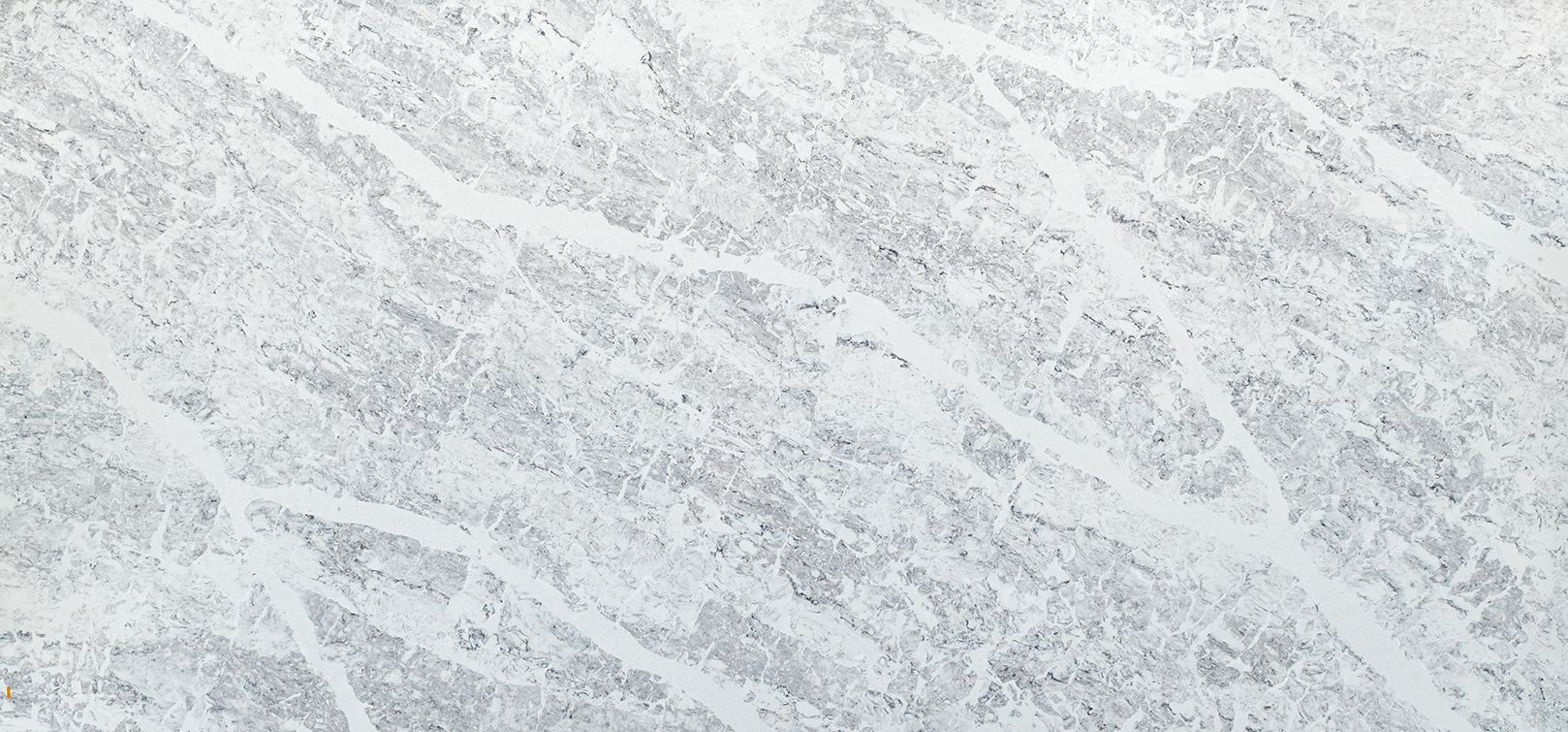 White granite surface with gray veining.