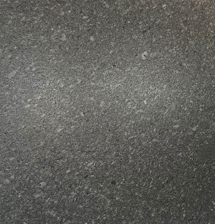 Dark gray textured granite surface.