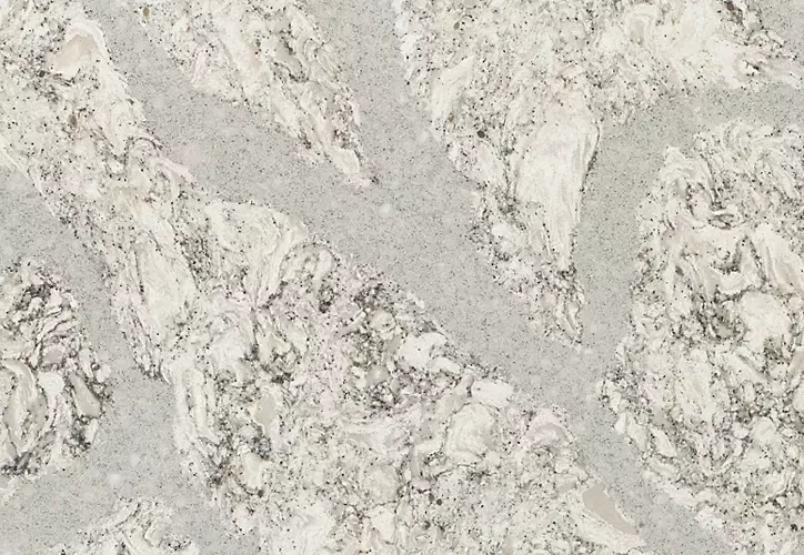 Light gray and white speckled countertop with veining.