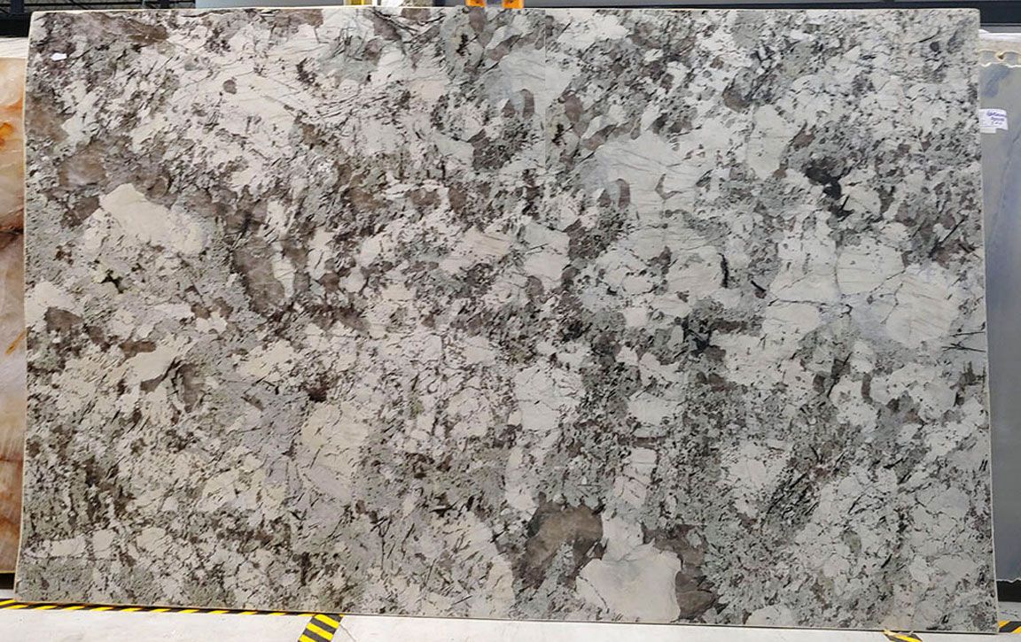 Large slab of granite with a pattern of gray and white veining.