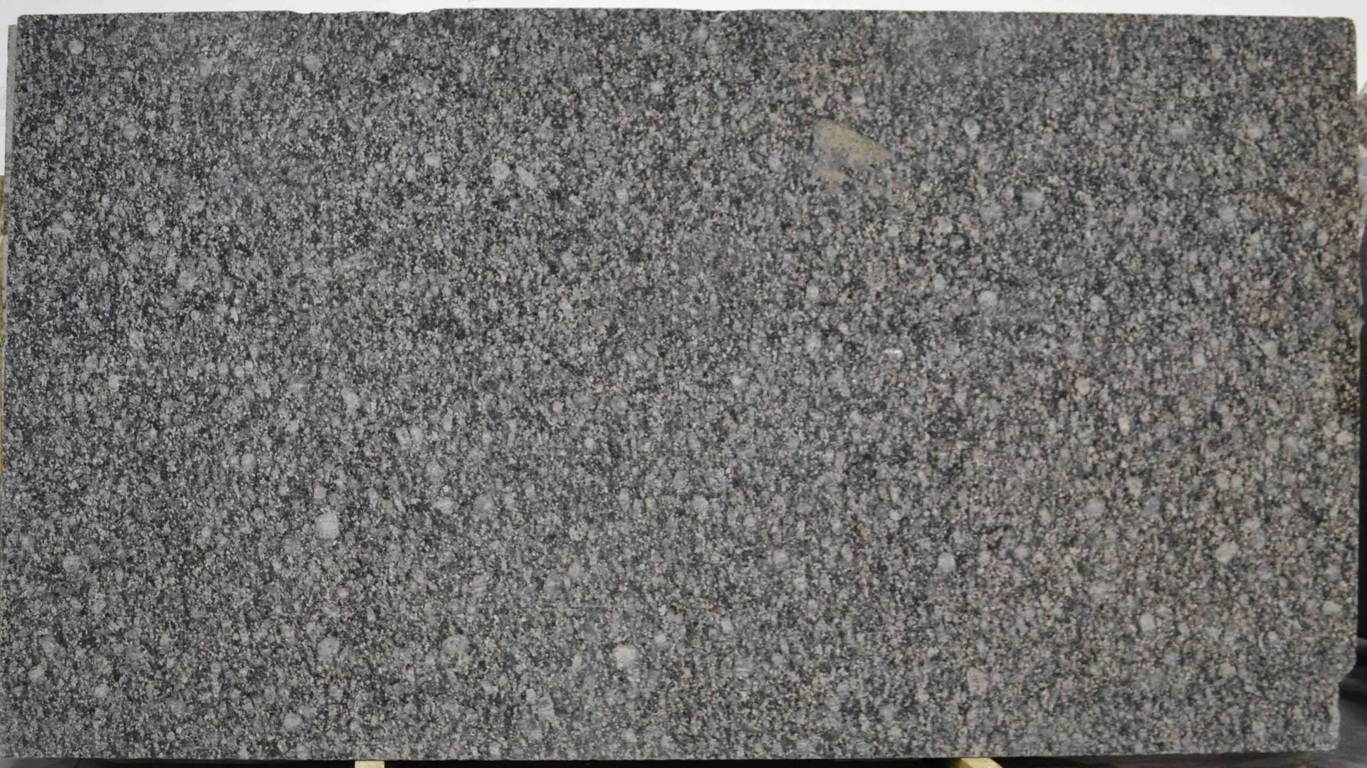 Gray granite slab with speckled texture, rectangular shape.