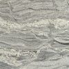 Gray and white marbled stone with swirling patterns.