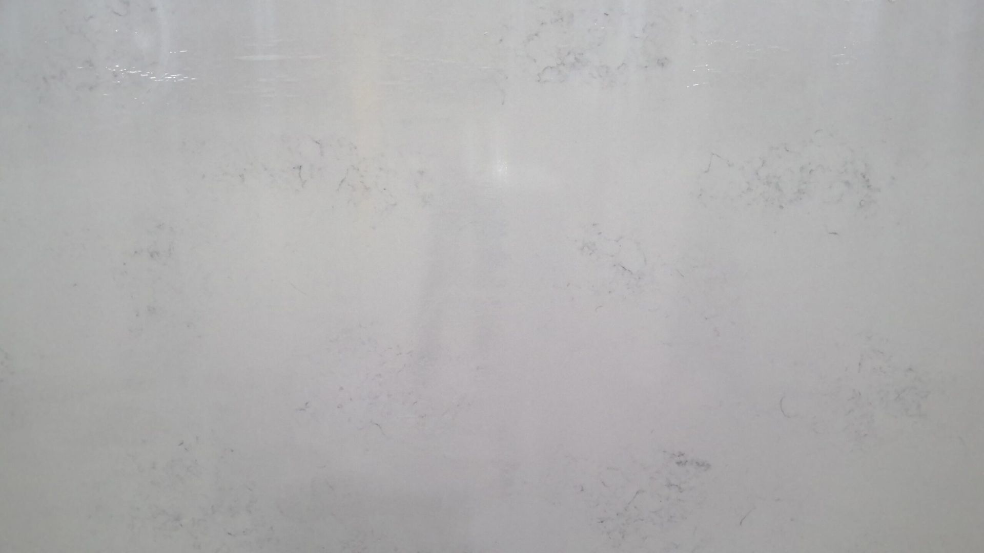 White and gray marbled stone surface.