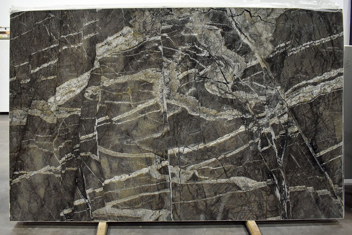 Large slab of dark gray and white marble with prominent veining patterns.