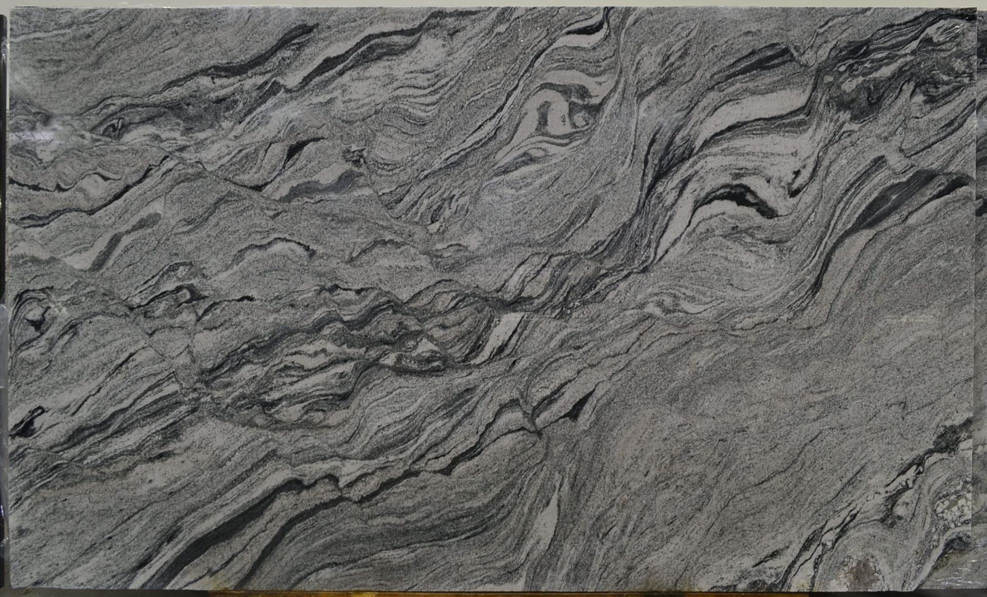 Gray and black swirling granite countertop.