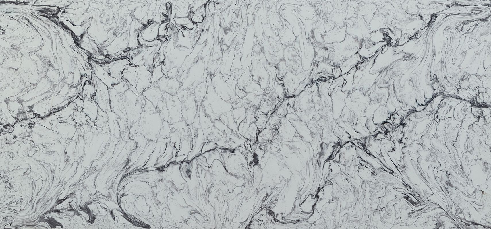 White marble countertop with grey veining.