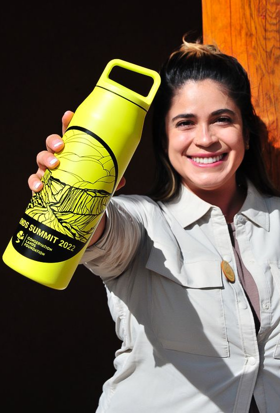 CLF staff member holds up a Miir water bottle