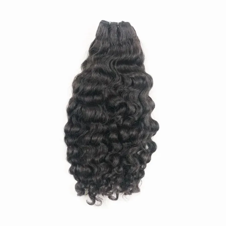 Hand holding a bundle of long, black, curly hair extensions against a white background.
