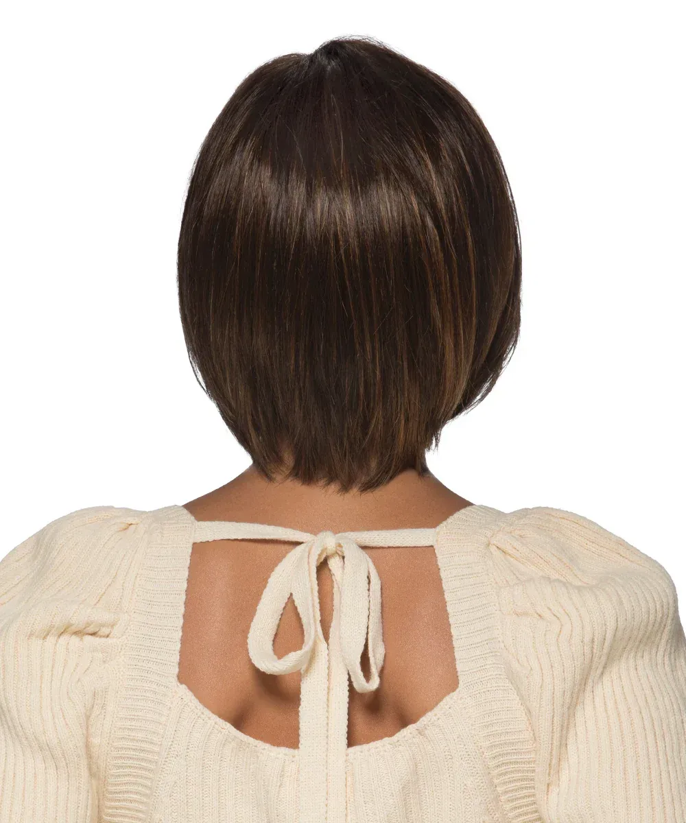 A woman wearing a wig and a white sweater