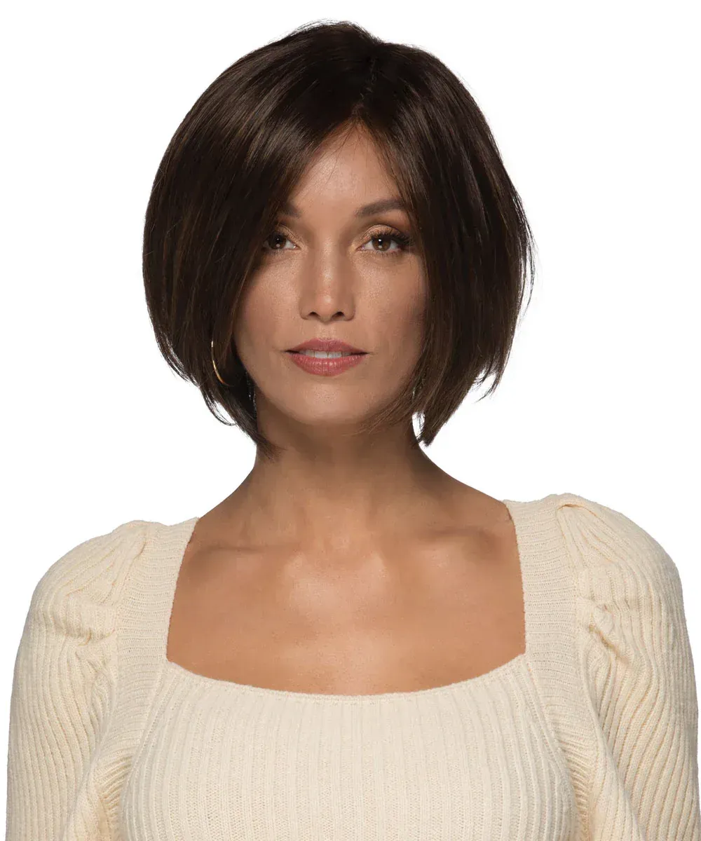 A woman wearing a wig and a white sweater