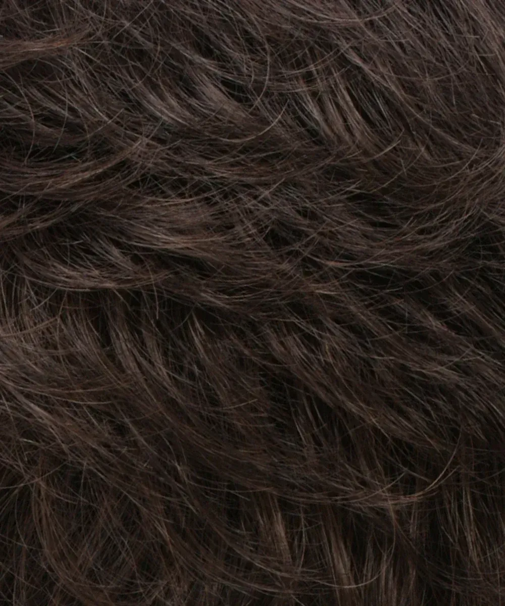 A close up of a piece of brown hair.