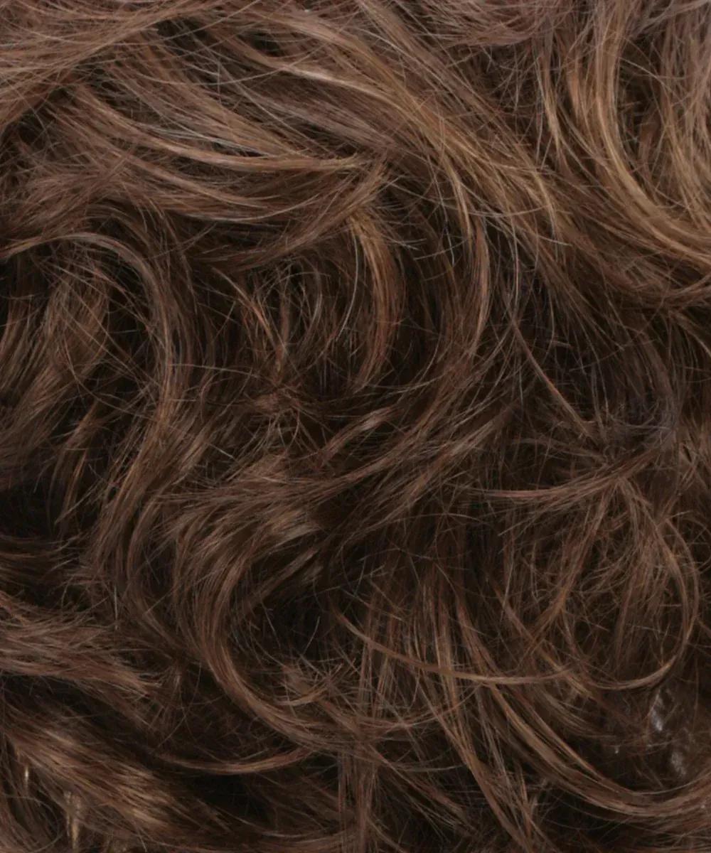 A close up of a piece of brown hair.