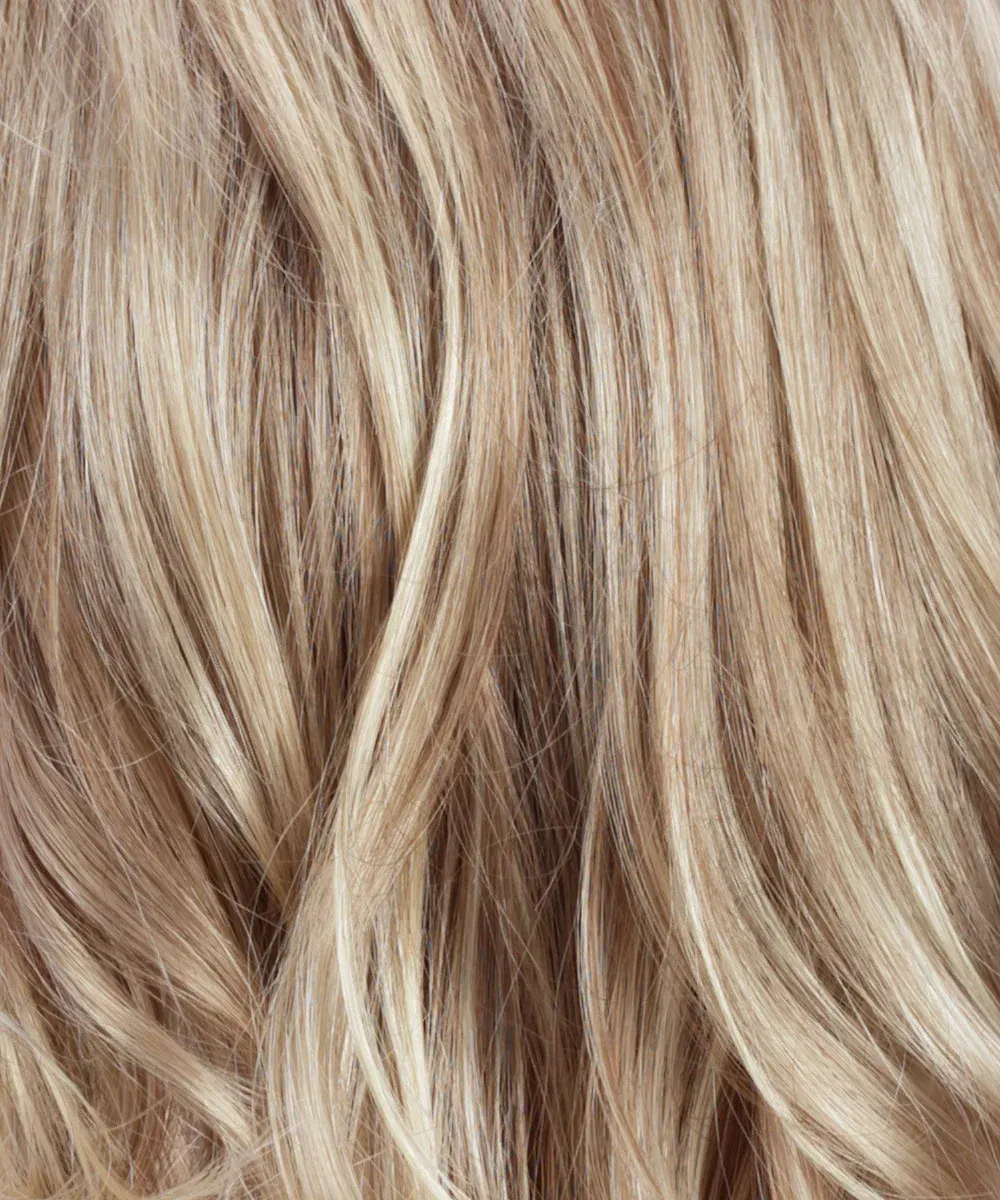 A close up of a woman 's blonde hair.