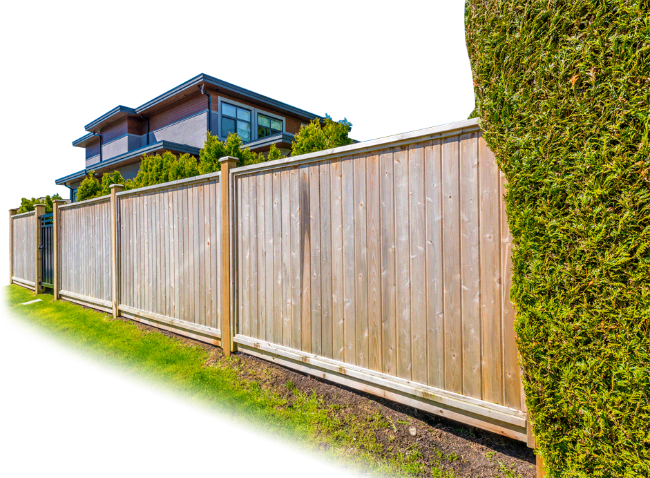 Wooden fence on private property with lush green surroundings