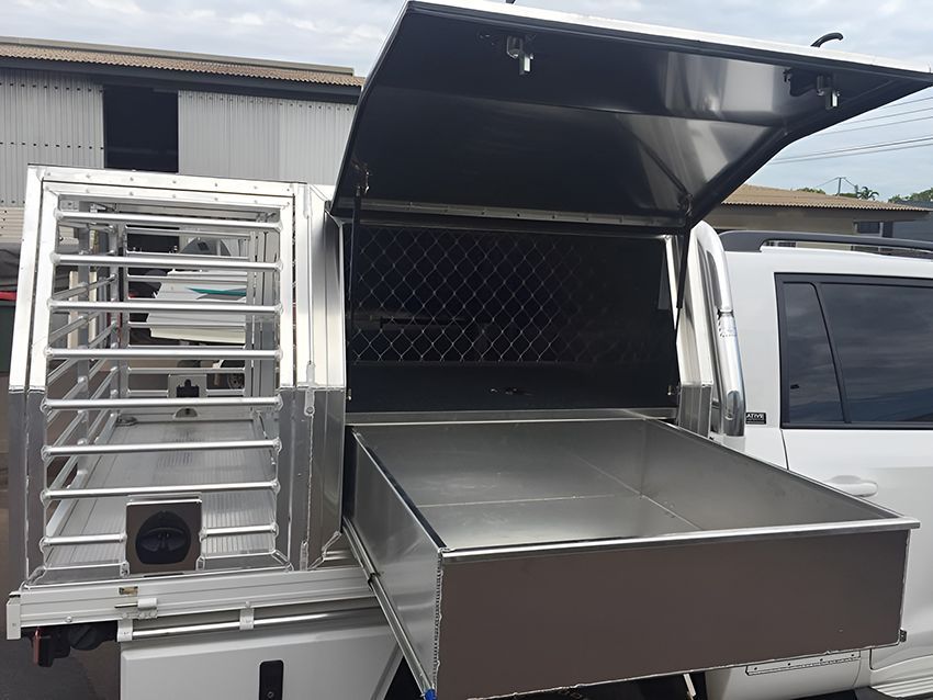 A white truck with a stainless steel canopy and a drawer underneath it. — Allycraft Modifications in Berrimah, NT