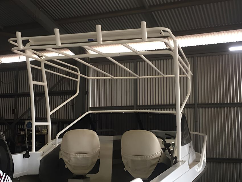 A White Boat in a Warehouse with a Metal Roof — Allycraft Modifications in Berrimah, NT
