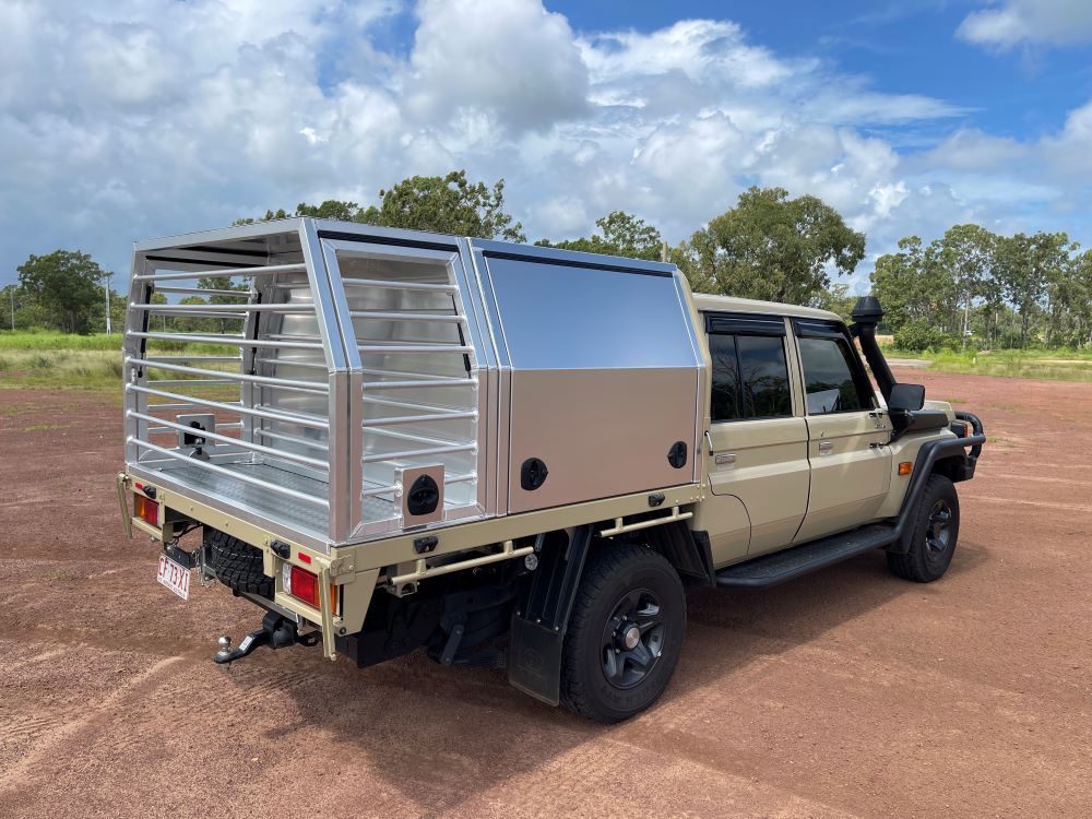 A Truck With a Canopy on the Back of It is Parked in a Dirt Field — Allycraft Modifications in Berrimah, NT