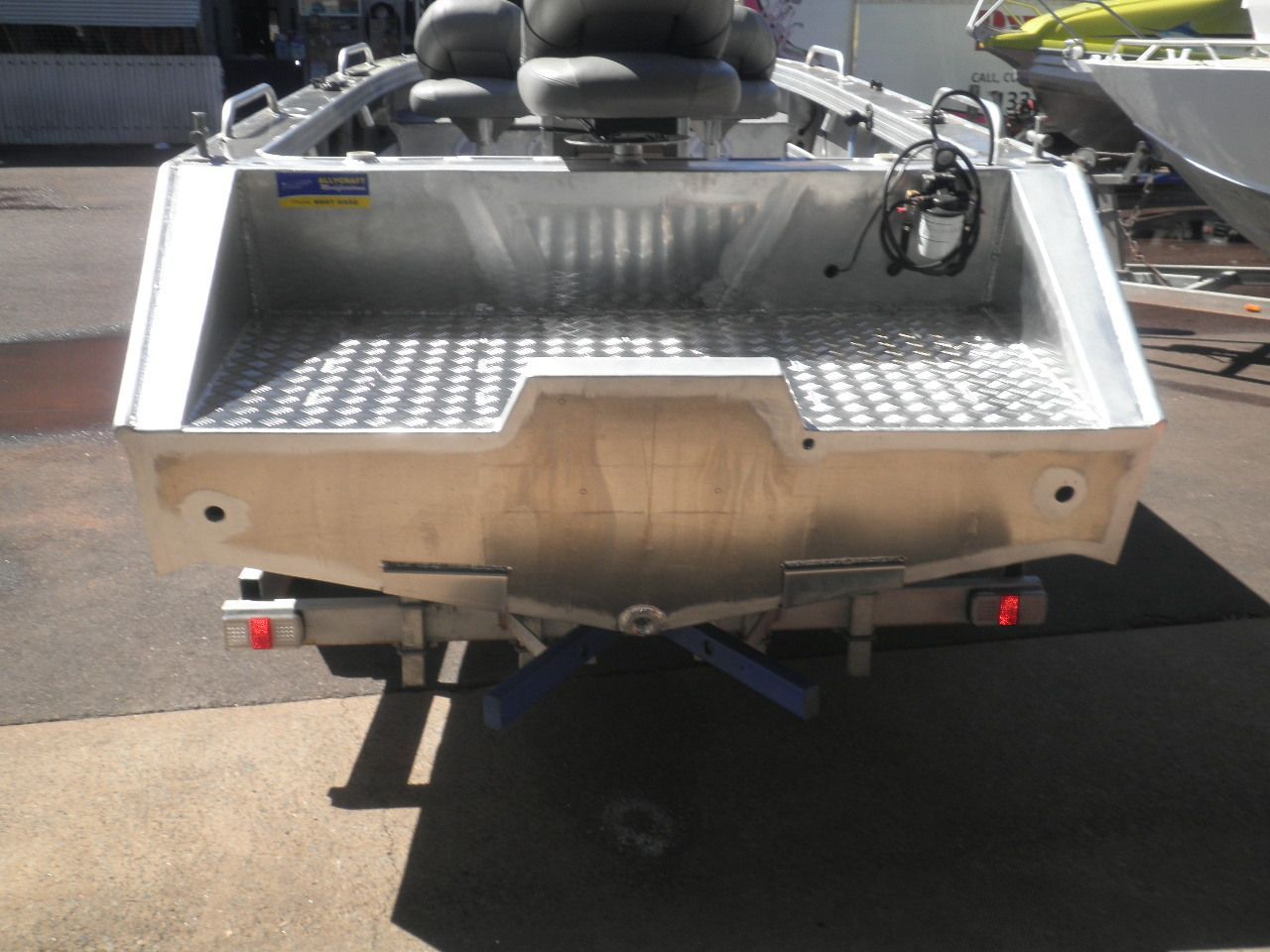 A silver boat with a trailer attached to it — Allycraft Modifications in Berrimah, NT