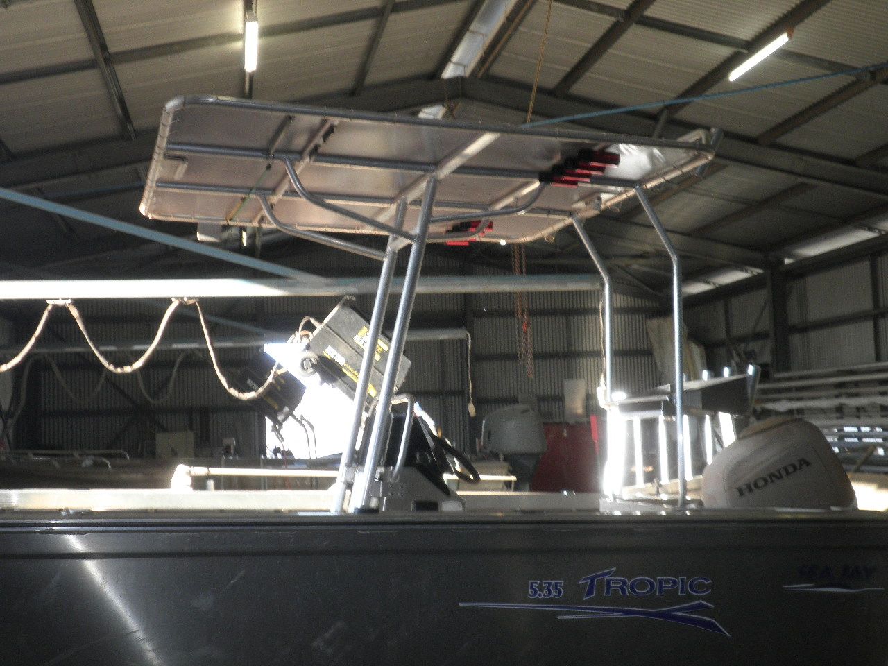 A silver boat with a honda outboard motor — Allycraft Modifications in Berrimah, NT