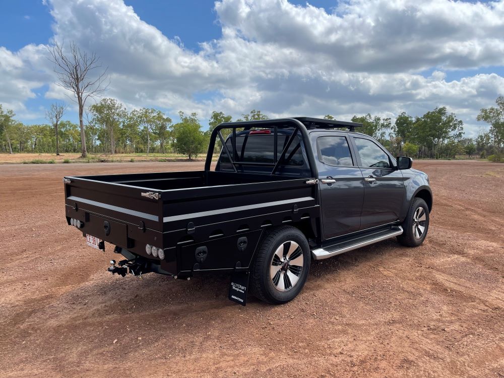 A Black Truck is Parked in a Dirt Field — Allycraft Modifications in Berrimah, NT