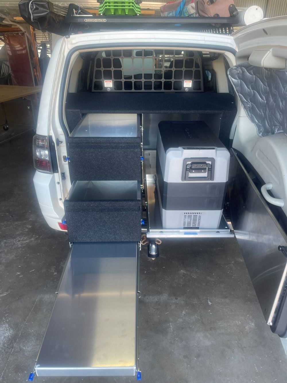 A white van with a cooler and stairs in the back — Allycraft Modifications in Berrimah, NT