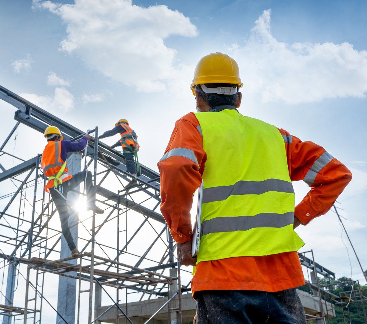 Construction Workers Installing Metal Structure — Fort Walton Beach, FL — Waldorff Insurance & Bonding