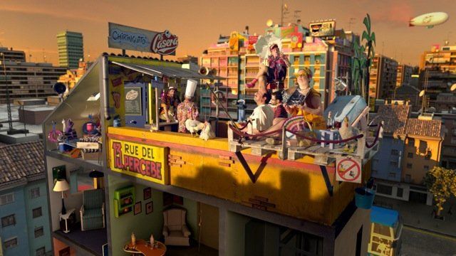 Un grupo de personas está de pie encima de un edificio que dice rue del pueblo.