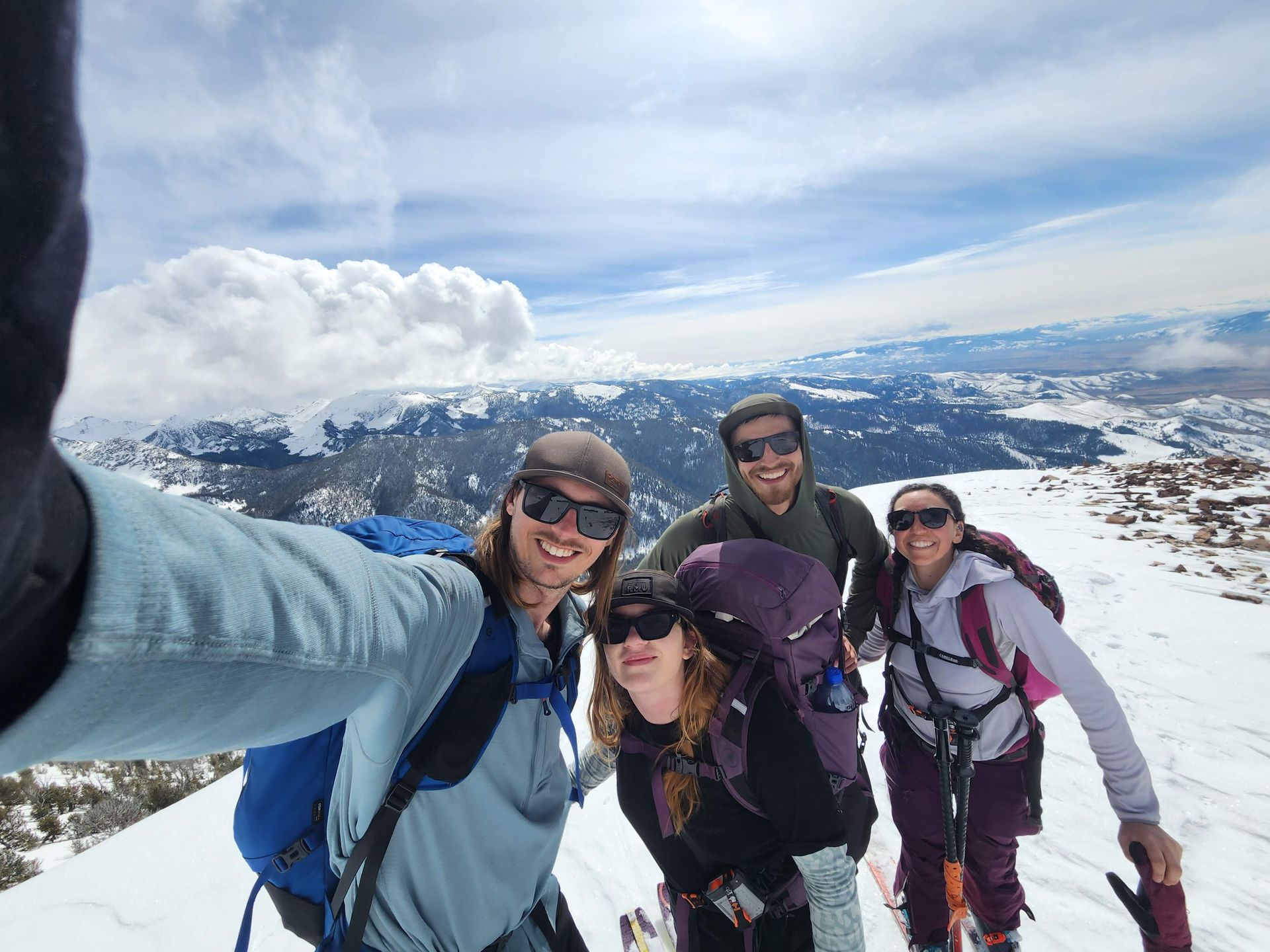 Me on top of a mountain about to ski down with friends