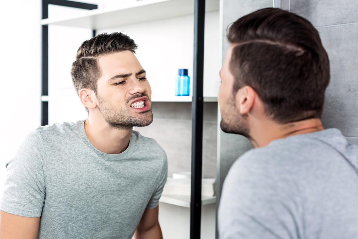 Dental Services — Man Looking His Teeth in Washington, D.C