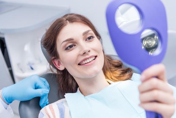Woman Smiling in Dental Clinic — Washington, DC — Michael G. Landy DDS