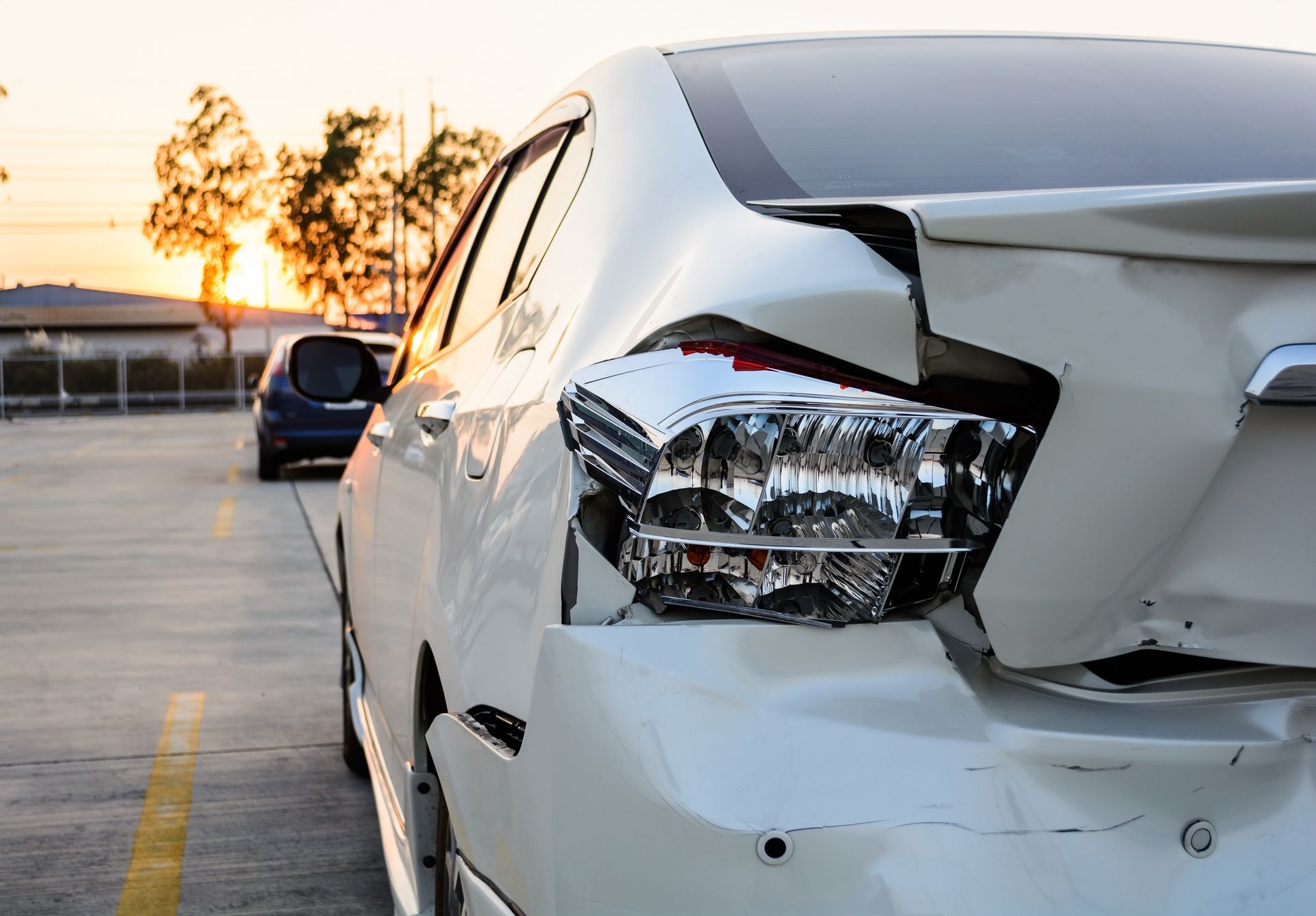 totaled but still drivable car, back bumper crash