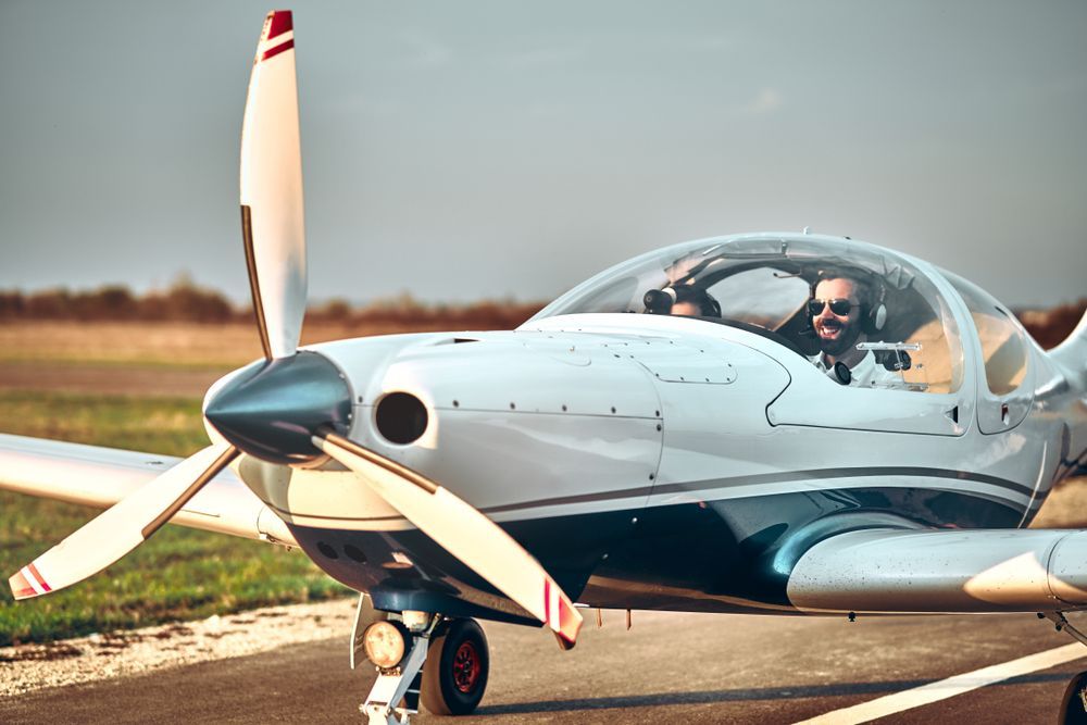 a pilot in traning  sits in their training plane learning the difference between vfr and ifr flying