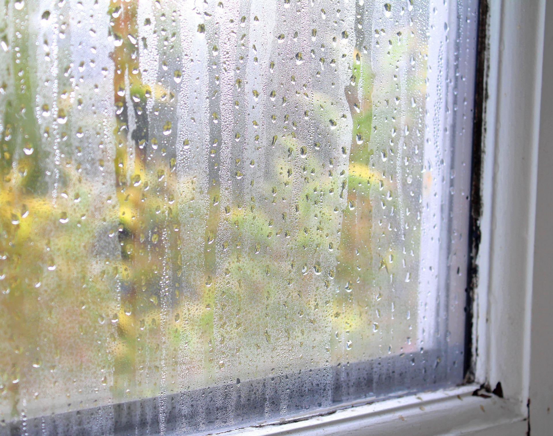 A close up of a foggy window